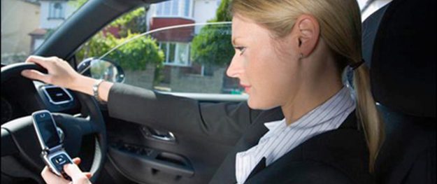 Woman driving while texting